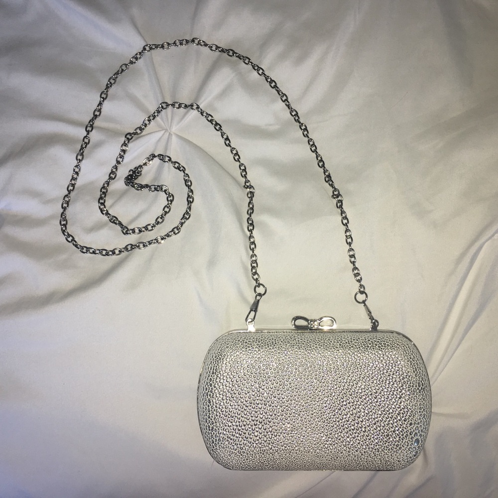 Claire’s Silver Sparkly Bow Top Clutch